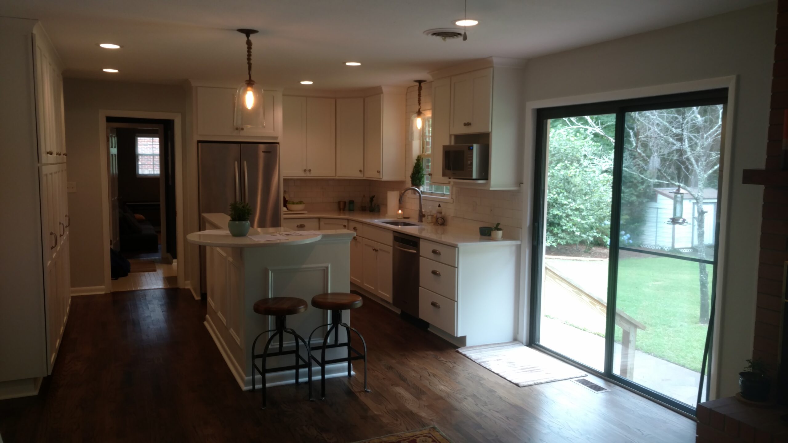 Photo is of a kitchen that has been remodeled. A patio door is included in the picture. Some remodeling will provide more sellers proceeds