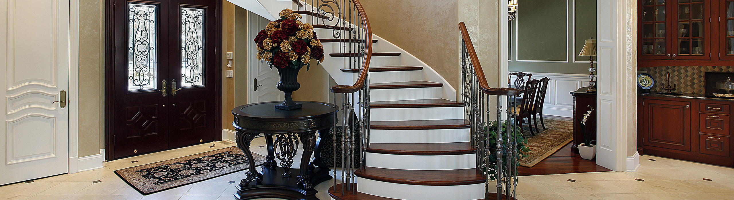 Decorative photo of a fancy balustrade in a grand opening in what looks like a luxury home. Pricing a home correctly is the best way to get the most money from your house sale.