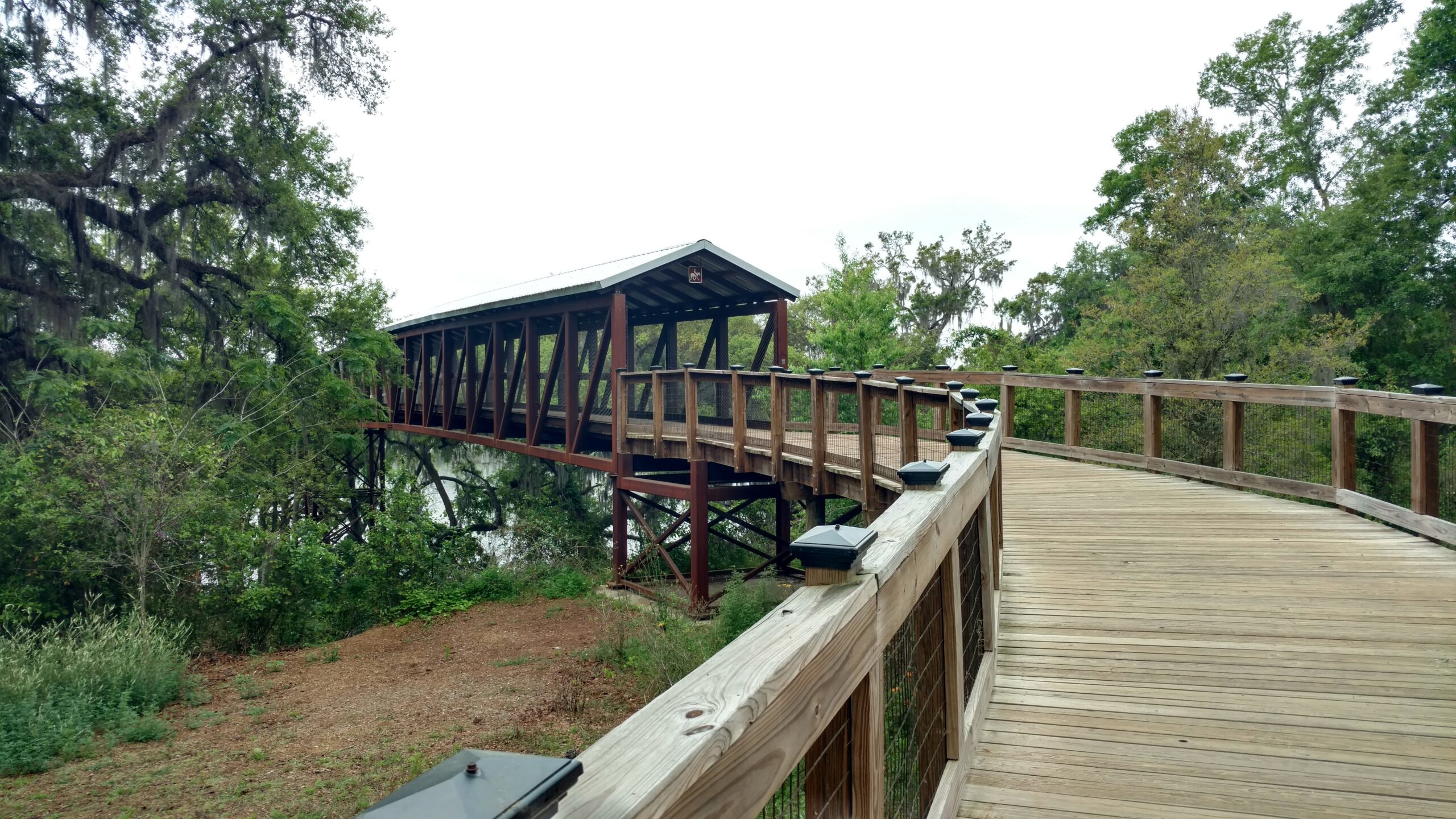 Decorative photo taken by a Tallahassee Realtor of the covered bridge near Lake Lafayette and Alford Greenway