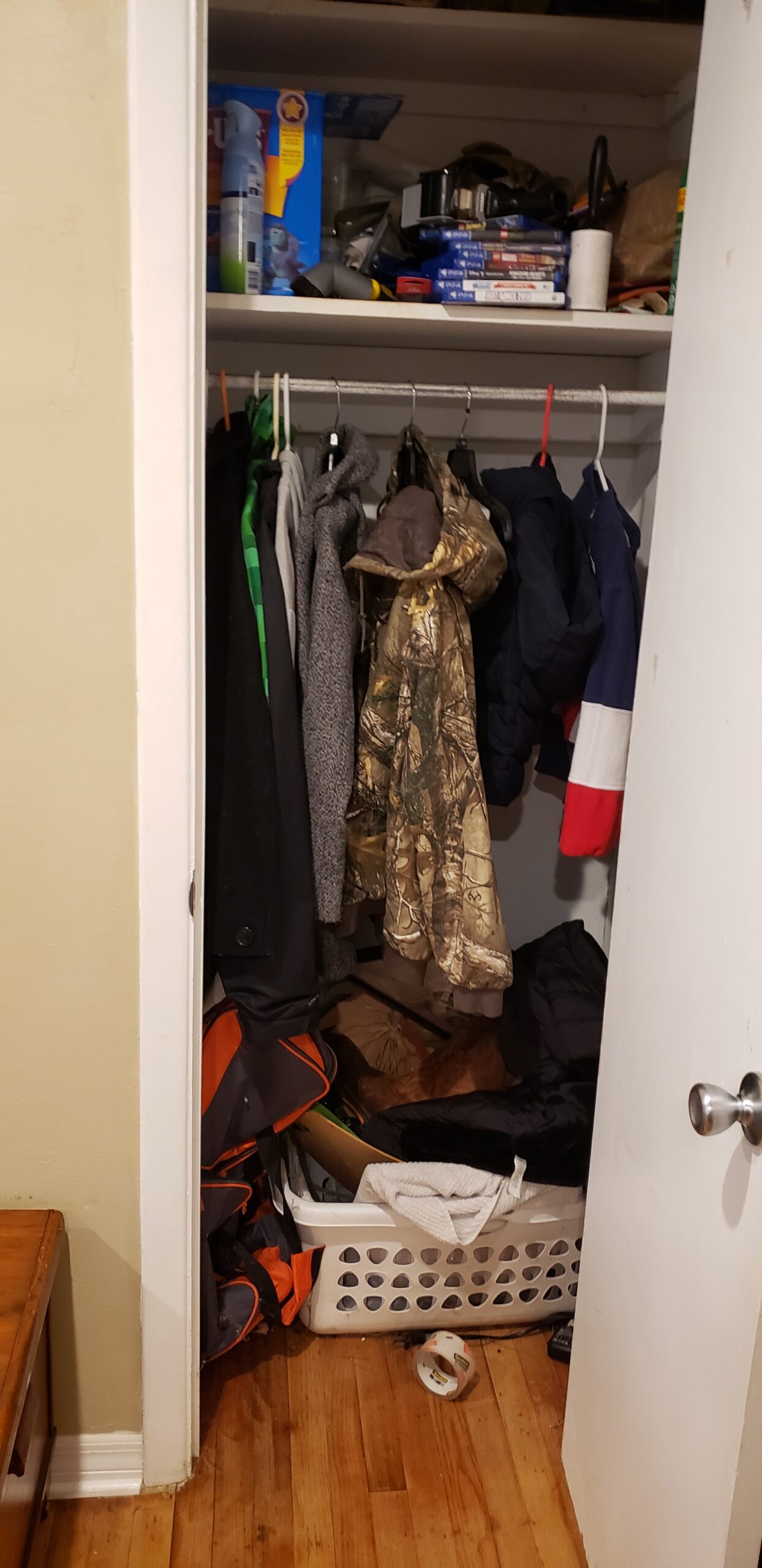 Picture is decorative. It shows a closet full of clothes and a floor covered. When prepping a home for sale, clean out closets because buyers will open them!