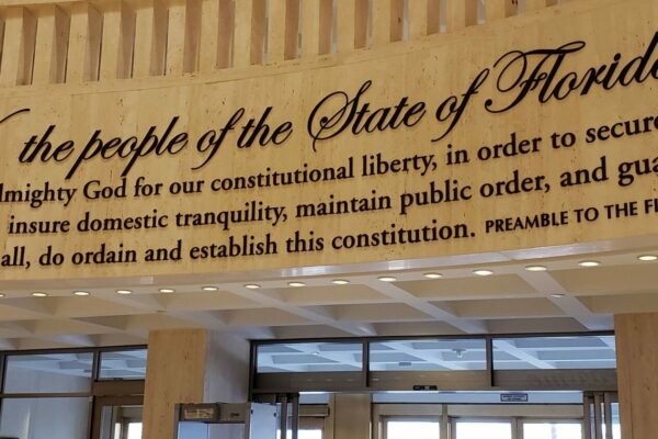 Photo shows inside of Capitol rotunda and the phrase We the people of the state of Florida and the preamble to the FL constitution.
